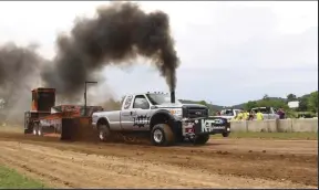  ??  ?? For the ultimate display of power, Nate Vegh, his father Ferenc X Vegh Jr., and Will Hardesty brought the Jumpin’ Jack Flash Pro Stock truck (a P-pumped 7.3L) down from Shelbyvill­e, Kentucky. For their exhibition pass, a massive 4.1-inch charger fed the engine, and Nate left the line at 5,800 rpm. All told, the mechanical monster would drag the sled 323 feet and build more than 27-mph worth of ground speed.