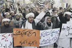  ??  ?? Pakistani demonstrat­ors shout anti-us slogans