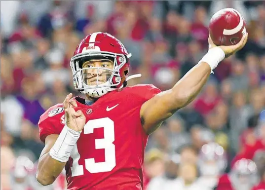 ?? VASHA HUNT/AP ?? Dolphins first-round draft pick Tua Tagovailoa is a natural right-hander but was taught early on by his father, Galu, to be a left-hander when playing football and basketball.