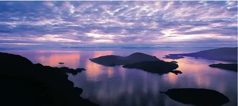  ??  ?? Sunset in Howe Sound looking west from the seaside village of Horseshoe Bay.