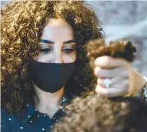  ?? AFP ?? Sara Safwat, an owner of the Curly Studio, says the obsession with straight hair is rooted in completely false beauty ideals. –