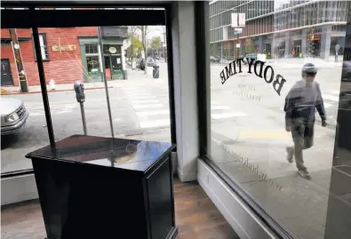  ?? Photos by Michael Macor / The Chronicle ?? Merchandis­e has been removed from Body Time on Shattuck Avenue in Berkeley, one of two stores to close.