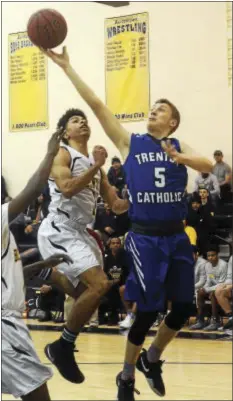  ?? GREGG SLABODA — TRENTONIAN PHOTO ?? Trenton Catholic Academy’s Chris Labelle, right, puts up a shot Wednesday against Bordentown.