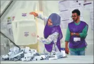  ?? MOHAMED AFRAH / AFP ?? Officials prepare to count votes for the Maldives’ parliament­ary elections at a polling station in Male on Sunday.