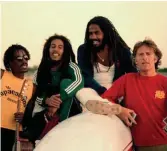  ??  ?? Reggae boys: Bob Marley (2nd left) and Chris Blackwell (right). Jamaica, 1980