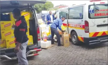  ??  ?? BIO+ECH Health Group staffers load donations destined for Cyclone Idai victims into vehicles