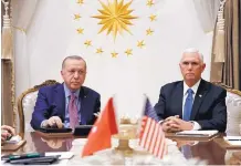  ?? JACQUELYN MARTIN/ASSOCIATED PRESS ?? Vice President Mike Pence, right, meets with Turkish President Recep Tayyip Erdogan at the Presidenti­al Palace for talks on the Kurds and Syria Thursday in Ankara, Turkey.