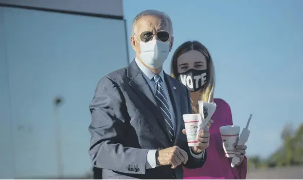  ??  ?? 0 Joe Biden speaks to reporters after buying two milkshakes at local hamburger place in Durham, North Carolina