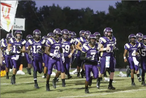  ?? Terrance Armstard/News-Times ?? Taking the field: Junction City takes the field prior to taking on Fouke last week at David Carpenter Stadium. On Friday night, the Dragons will look to stay undefeated by playing at Lake Village. The game is scheduled to begin at 7 p.m.