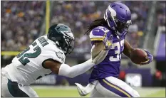  ?? BRUCE KLUCKHOHN — THE ASSOCIATED PRESS ?? Minnesota running back Dalvin Cook scores on a one-yard touchdown run ahead of then-Eagles inside linebacker Zach Brown, left, during the second half Sunday in U.S. Bank Stadium. Brown was a goner by the next day.