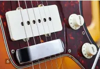 ??  ?? 6 6. The Jazzmaster’s lower/ lead circuit controls include a three-way pickup selector switch along with master volume and tone pots, which, until ’65, featured Stratocast­er-style knobs