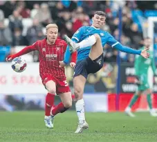  ?? ?? Harrison Burrows under pressure from Cheltenham’s Ryan Broom.