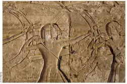  ??  ?? BOTTOM Egyptian archers shoot arrows at their enemies. In war scenes, Egypt’s troops were normally shown on a much smaller scale than the king. From Medinet Habu, Luxor