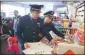  ?? CHEN XIAOGEN / FOR CHINA DAILY ?? Enforcemen­t officials check a shop in Beijing to make sure no counterfei­t goods are on shelves in early February.