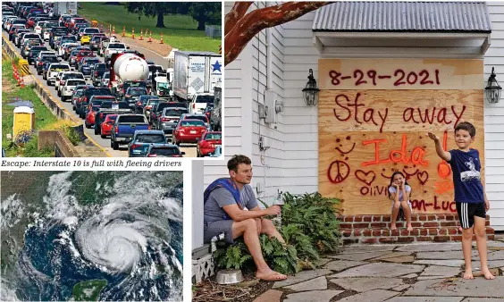  ?? Satellite image: Hurricane Ida off Louisiana ?? Escape: Interstate 10 is full with fleeing drivers
Staying put: Jean-Luc Bourg, eight, with sister Olivia, ten, and dad Jean Paul