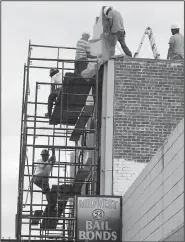  ?? NWA Democrat-Gazette/ANDY SHUPE ?? Workers continue to put the finishing touches on The Apollo on Emma on Friday on Emma Avenue in Springdale. The event space plans to open Thursday.