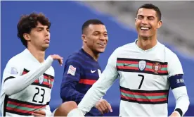  ?? Photograph: Franck Fife/AFP/Getty Images ?? France’s forward Kylian Mbappé (centre) shares a laugh with Cristiano Ronaldo at the teams’ Nations League meeting last Sunday.