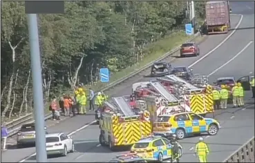  ??  ?? Emergency crews were on the scene this morning after the rush-hour crash on the M8