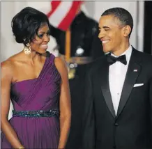  ?? OLIVIER DOULIERY/ ABACA PRESS/ MCCLATCHY ?? Jodi Kantor’s book tries to look behind the scenes at the marriage of President Barack Obama and First Lady Michelle Obama.