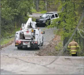  ?? The Sentinel-Record/Mara Kuhn ?? Entergy Arkansas Inc. customers in the St. George Street area were without power Wednesday afternoon after a tree fell on electrical lines. The Hot Springs Police Department provided traffic control, and the Hot Springs Fire Department was also called...