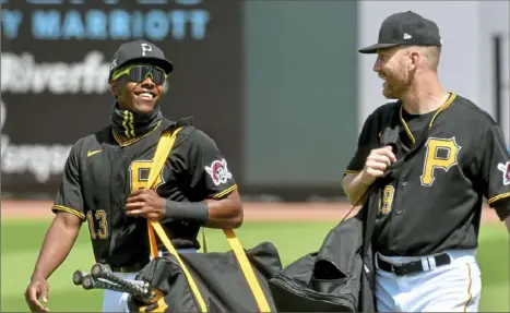  ?? Matt Freed/Post-Gazette photos ?? Todd Frazier learned from any number of veterans when breaking into the major leagues a decade ago. Now, Frazier’s unwritten role is to help Ke’Bryan Hayes, left, as he finds his place.