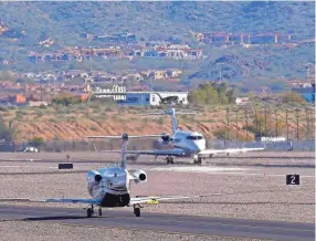  ?? ROSS D. FRANKLIN/AP ?? Private planes make their way to takeoff Thursday at Scottsdale Airport in Ariz. Private jet traffic at the airport is expected to increase dramatical­ly leading up to the Super Bowl.