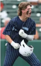  ?? ALLEN CUNNINGHAM/SUN-TIMES ?? Cole Reifsteck celebrates after scoring a run during Nazareth’s five-run fifth inning.