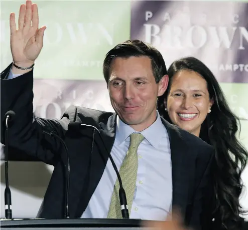  ?? JACK BOLAND / POSTMEDIA NEWS ?? Patrick Brown with his wife Genevieve on Monday night after he won the race for mayor of Brampton.