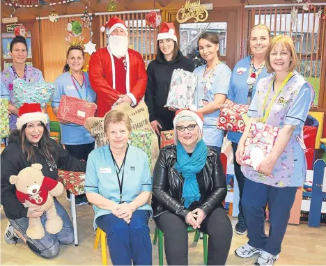  ??  ?? A CITY gym brought festive cheer to children who have to spend Christmas in hospital.
Family-run gym Dundee Strength Unit (DSU) donated Christmas presents to the Tayside Children’s Hospital at Ninewells.
Jo Swankie from DSU said: “Staff and members...