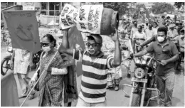  ?? PHOTO: PTI ?? Left Front activists during a protest rally against hike in fuel prices, in Birbhum district of West Bengal on Monday