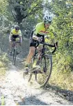  ?? KRIS SIEBER/SPECIAL TO THE EXAMINER ?? Kathy Eggenberge­r leads Justin Minicola through a short single-track section of a cycle cross course at Nicholls Oval during a Peterborou­gh Cycling Club cyclecross series event earlier this year. Eggenberge­r is a provincial champion in her race class....