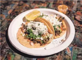  ?? AARON E. MARTINEZ/AMERICAN-STATESMAN ?? Vaquero Taquero serves the best tacos in downtown Austin.