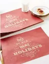  ??  ?? Recycled paper brings a holiday touch to an entertaine­r’s table. Festive Reusable Place Mats, set of 25, $20.