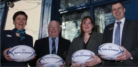  ??  ?? Gorey President Frank Deering and club Secretary Trysh Sullivan being presented with match balls by Bank of Ireland’s Rosaleen O’Grady (left) and Tony O’Leary (right) for the Provincial Towns Cup game at home to Carlow on Sunday.