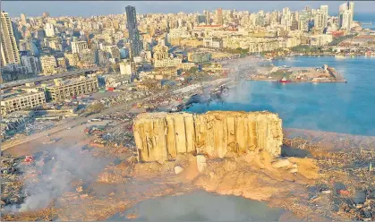  ??  ?? EPICENTRE OF THE BLAST: An aerial image shows the scene of destructio­n at the seaport of Beirut in Lebanon on Wednesday, a day after the explosion.