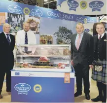  ??  ?? 0 Jim Buchan, of Highland Meats, Laurent Vernet of QMS, Simon Dowling of Scotbeef and QMS’S Jim Mclaren, from left, at the SIAL fair near Paris yesterday