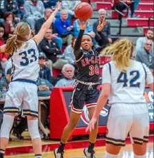  ?? Christian Snyder/Post-Gazette ?? New Castle’s Aayanni Hudson takes a jump shot during a playoff game against Knoch on Monday at Fox Chapel High School. Knoch won, 43-35.