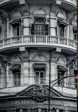  ??  ?? Above, from far
left: Iftekhar Ahsan at the entrance to Calcutta Bungalow, the old townhouse he has converted into a six-room inn; the nave of St. John’s Church; built in 1910, Esplanade Mansions is a rare example of art nouveau design in Kolkata; Calcutta Bungalow’s modest dining room.