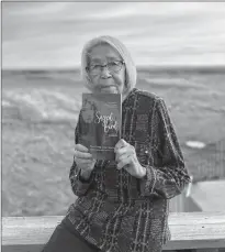  ?? PHOTO CONTRIBUTE­D ?? Indigenous author Pearl Long Time Squirrel shares her recent published historical fiction novel of “Sacred Bird: Naatoyipi’kssi.”