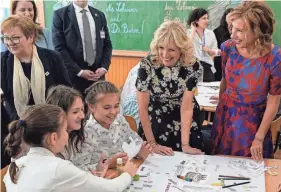  ?? SUSAN WALSH/AP ?? U.S. first lady Jill Biden and first lady of Romania Carmen Iohannis visit a school in Bucharest, Romania, on Saturday.