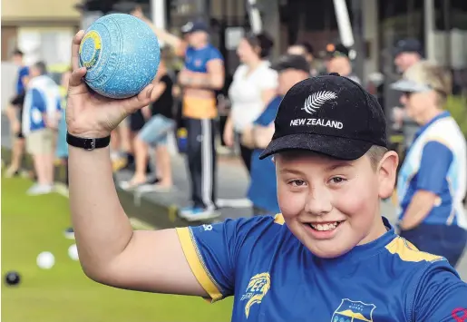  ?? PHOTO PETER MCINTOSH ?? Having a ball . . . Shilo Hogg (11) is introduced to bowls at the Taieri Bowling Club’s bowls3five tournament.