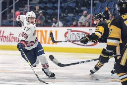  ?? GARY YOKOYAMA THE HAMILTON SPECTATOR ?? Former Bulldog Brandon Saigeon tries to thread the needle between the Hamilton defence during Thursday morning’s game. Saigeon’s Oshawa Generals beat the Bulldogs, 4-3 in a shootout.