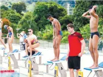  ??  ?? Proud (in red) with the Malaysian swimmers in Phuket.