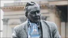  ??  ?? Top, fans at the John Smith’s Stadium before a Sky Bet Championsh­ip match last year; above, the statue of former Prime Minister Harold Wilson.