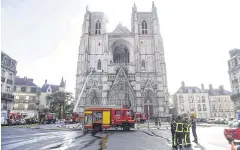  ?? AFP ?? Firefighte­rs work to put out a fire at the Saint-Pierre-et-Saint-Paul cathedral in Nantes, western France, on Saturday.