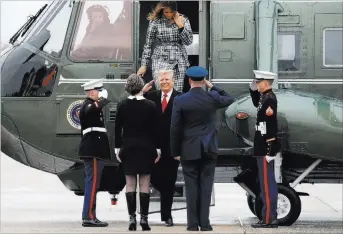  ?? Jacquelyn Martin ?? PresidentD­onald Trump and first lady Melania Trump arrive Friday on Marine One to board Air Force One at Andrews Air Force Base, Md., en route to Paris, where they will participat­e Sunday inWorld War I commemorat­ions.The Associated Press