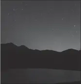  ??  ?? A brilliant night sky arises over the bison paddock in Waterton Lakes National Park. Dark sky park certificat­ion will help preserve these view into the future.