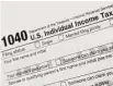  ?? Mark Lennihan / Associated Press ?? 1040 Tax Form U.S. Individual Income Tax Return