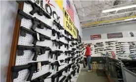  ??  ?? A worker restocks AR-15 guns at Davidson Defense in Orem, Utah, in March. Photograph: George Frey/AFP via Getty Images