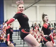  ?? Erik Trautmann / Hearst Connecticu­t Media ?? The New Canaan High School cheerleadi­ng squad competes during the FCIAC cheerleadi­ng championsh­ips at Wilton High School in Wilton on Feb. 8.